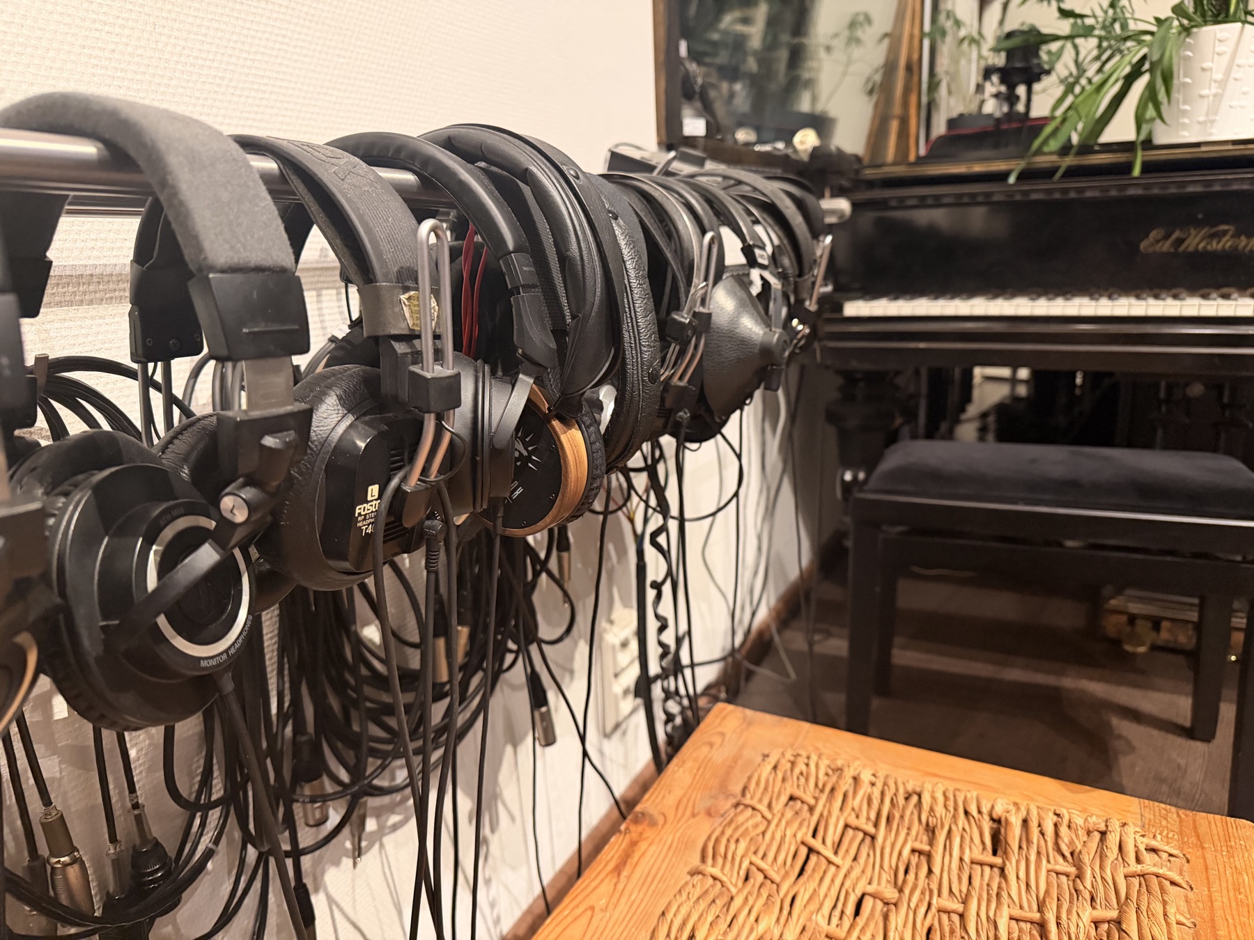 Studio headphones beside the grand piano